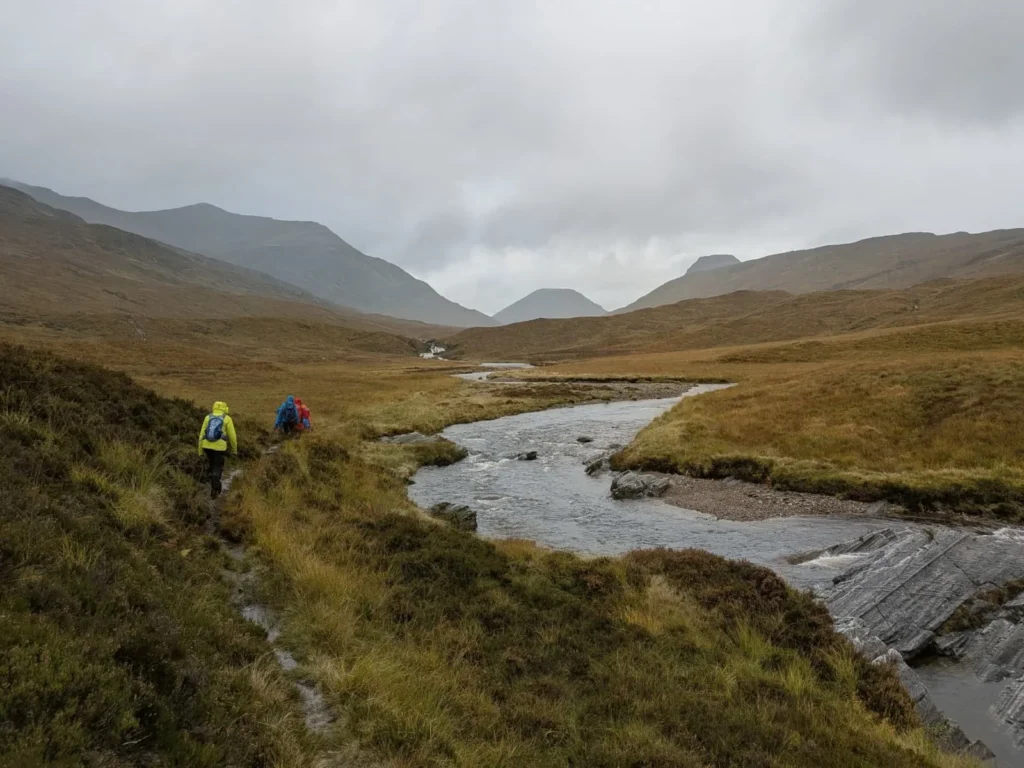 Walkers following the river through the Lairig Leacach