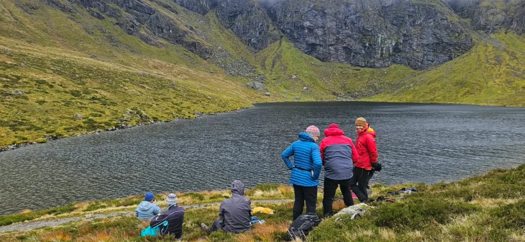 Walking group beside Lochan a Choire