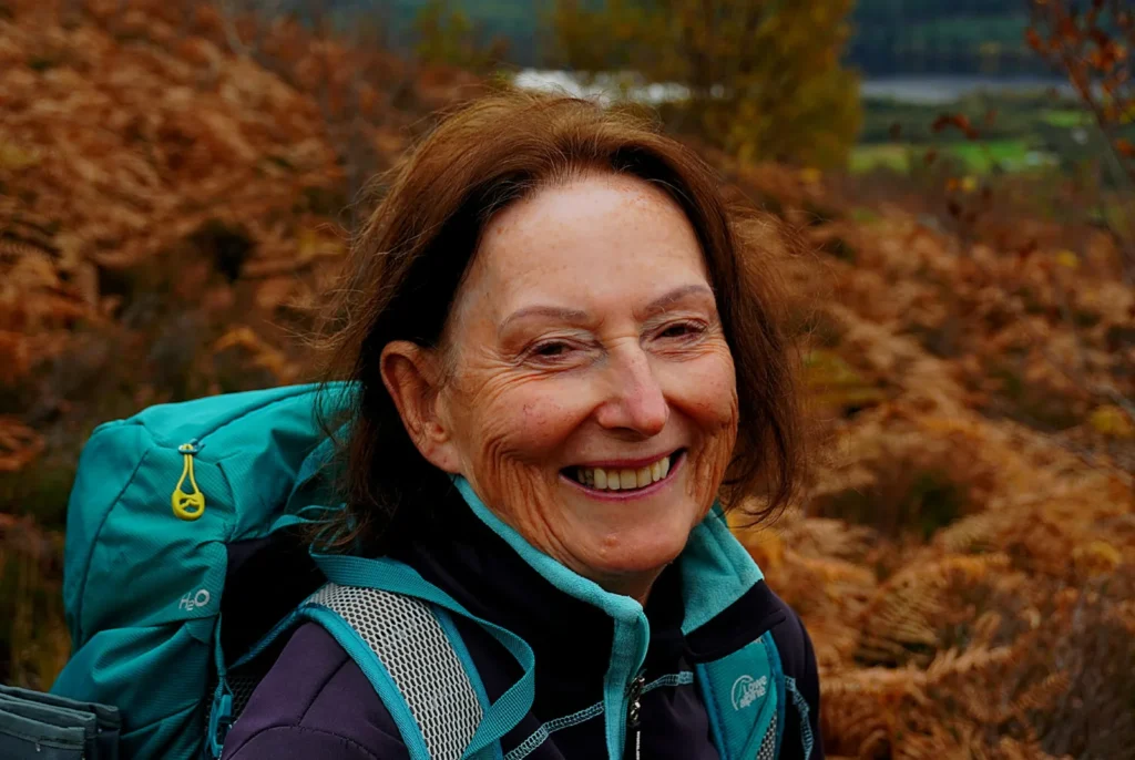 Smiling walker among the autumn bracken at Creag Meagaidh